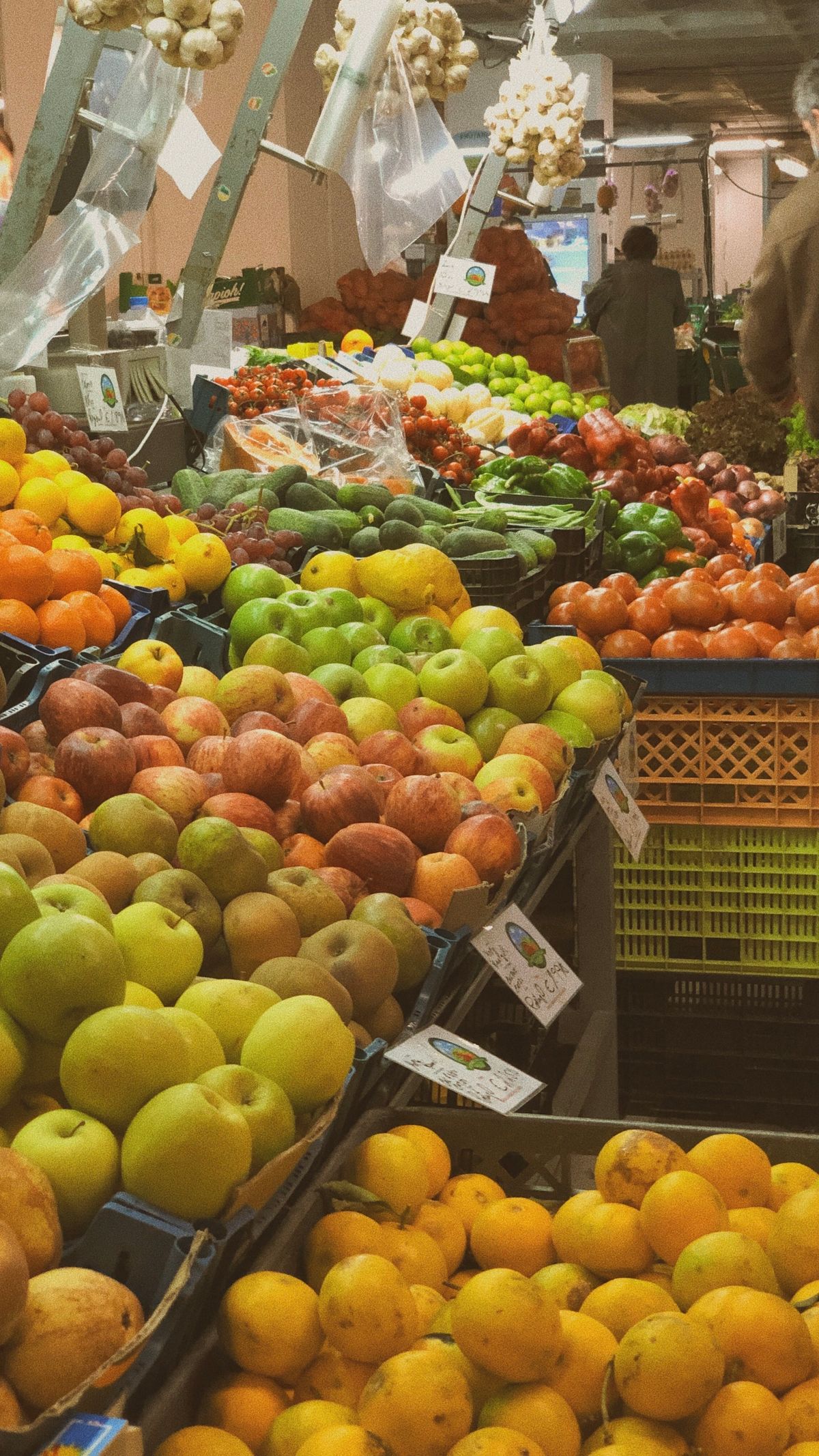 An assortment of fresh fruit at a market stand